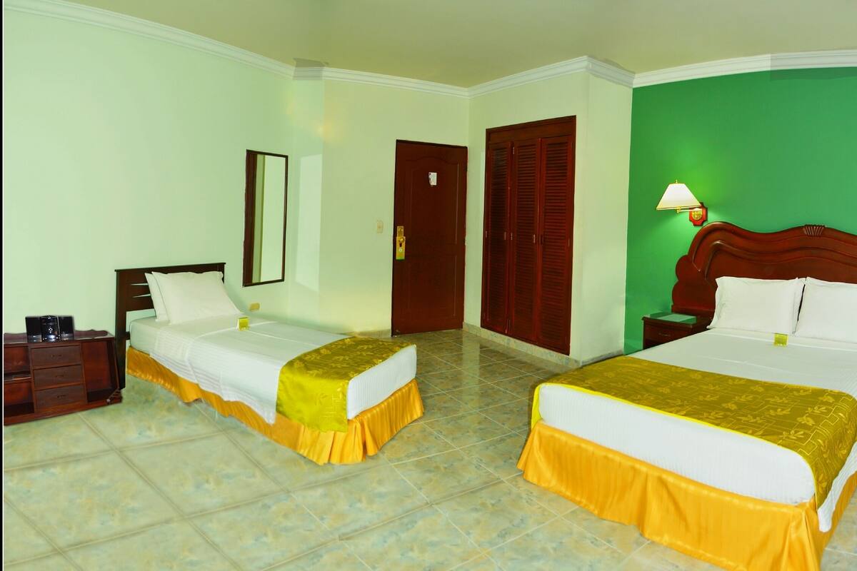 Triple Room | Minibar, in-room safe, desk, free cots/infant beds