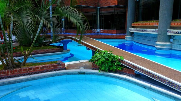 Indoor pool, open 9:00 AM to 9:00 PM, pool loungers