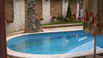 Outdoor pool, open 7 AM to 11 PM, pool umbrellas, sun loungers