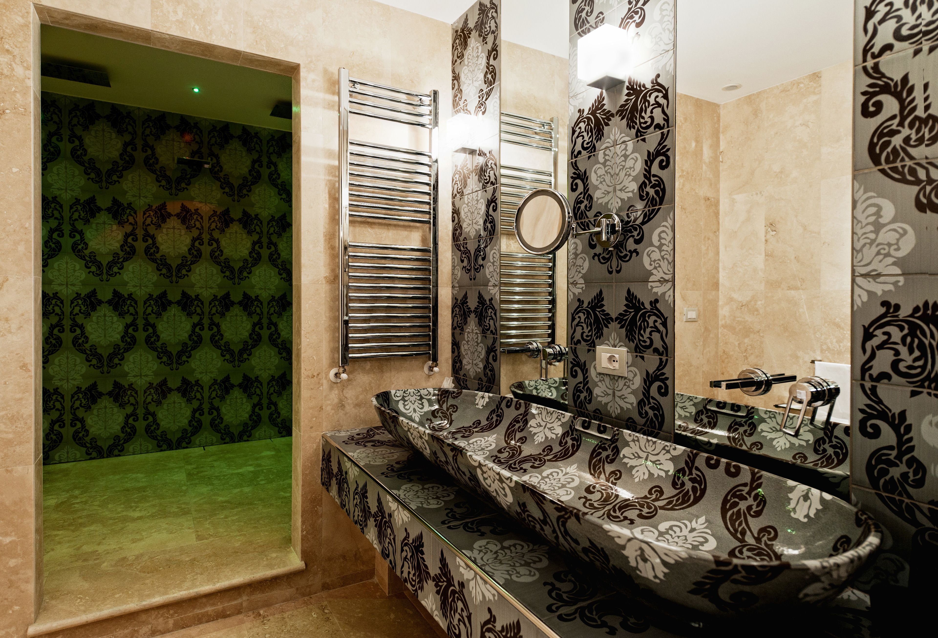 deluxe room | bathroom | rainfall showerhead, designer toiletries, hair dryer, bathrobes
