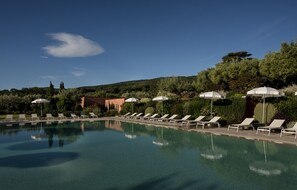 Seasonal outdoor pool, pool loungers