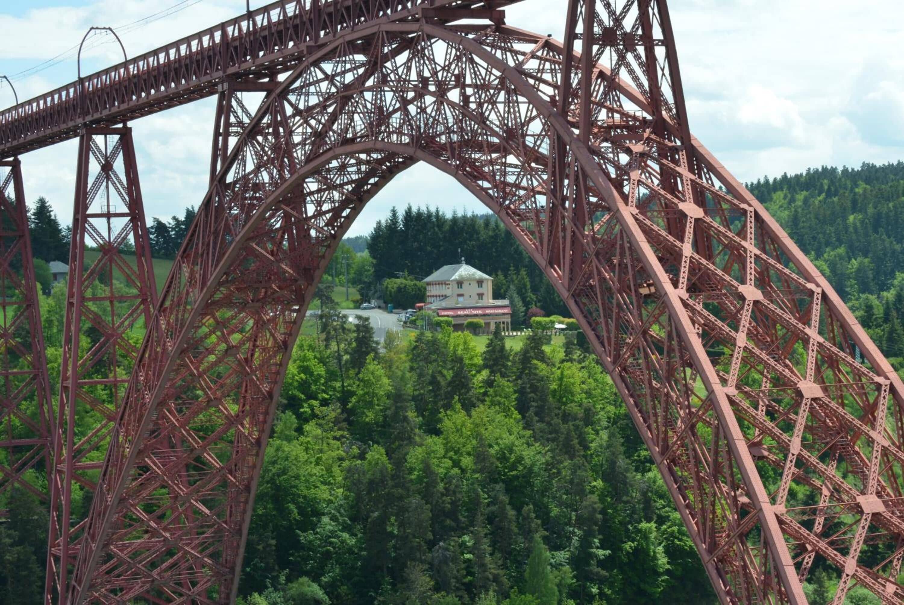 A large metal bridge structure with a complex truss design.