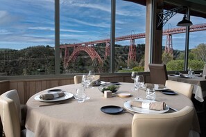 Lunch, dinner served; French cuisine, pool views