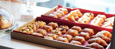 A variety of pastries displayed on a table.