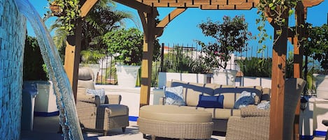 Outdoor pool, open 9:00 AM to 9:00 PM, pool umbrellas, pool loungers