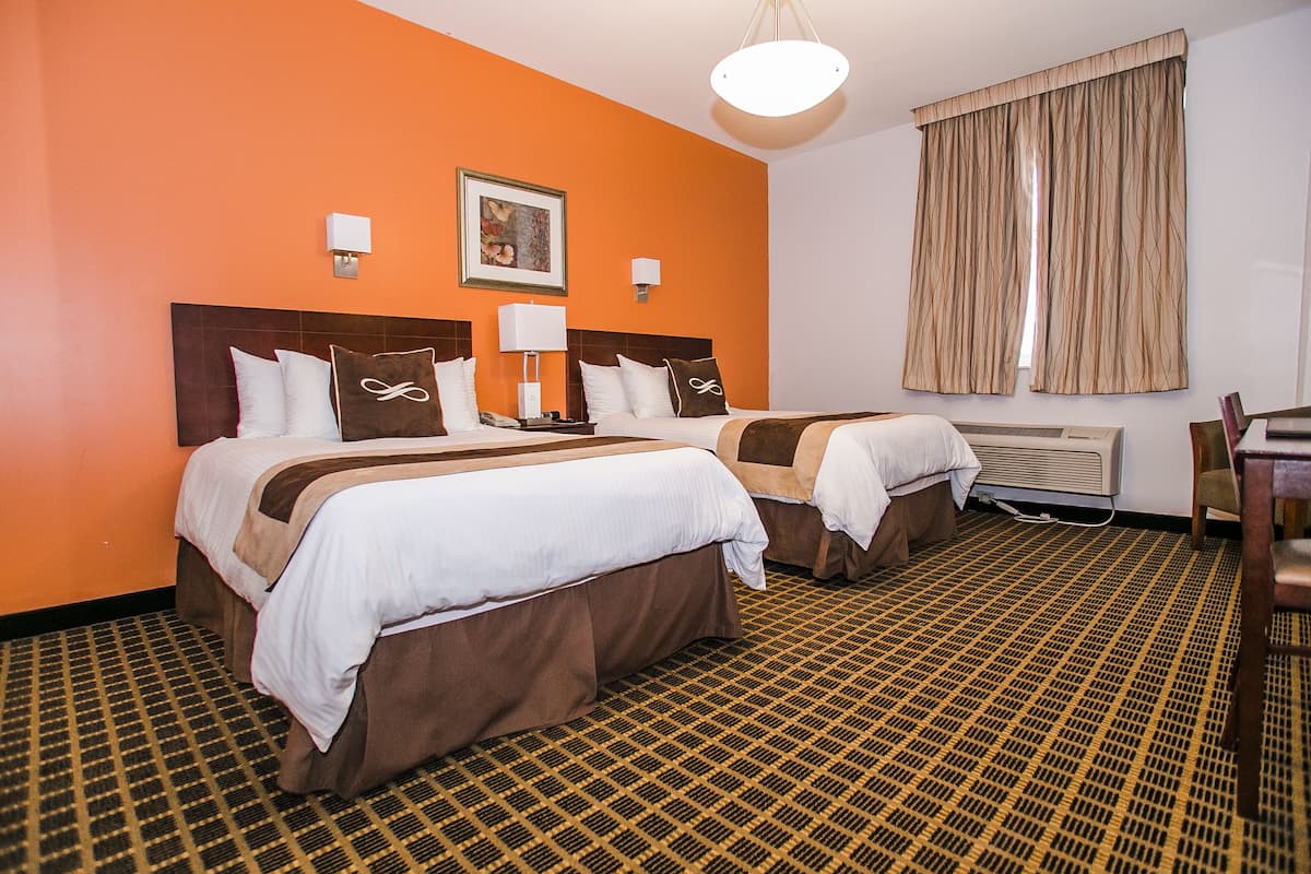 Suite ejecutiva | 1 habitación, ropa de cama de alta calidad y edredón