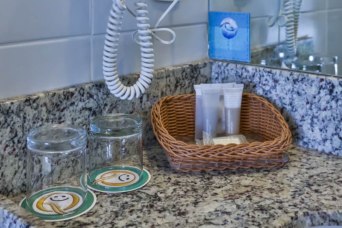 deluxe room, 1 queen bed | bathroom | shower, free toiletries, hair dryer, towels