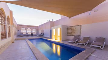 Indoor pool, outdoor pool, pool umbrellas