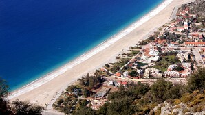 A coastal town with a beach, buildings, and surrounding hills. - Hotel Oludeniz (Fethiye)