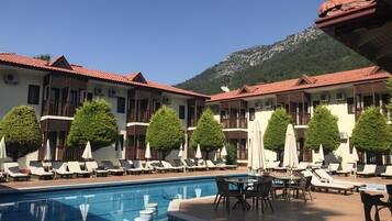 Outdoor pool, pool umbrellas, pool loungers