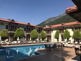 Outdoor pool, pool umbrellas, sun loungers