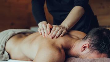 A person receiving a back massage.