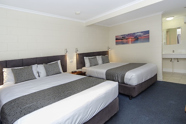 Standard Double Queen Room | Desk, blackout drapes, iron/ironing board, free WiFi