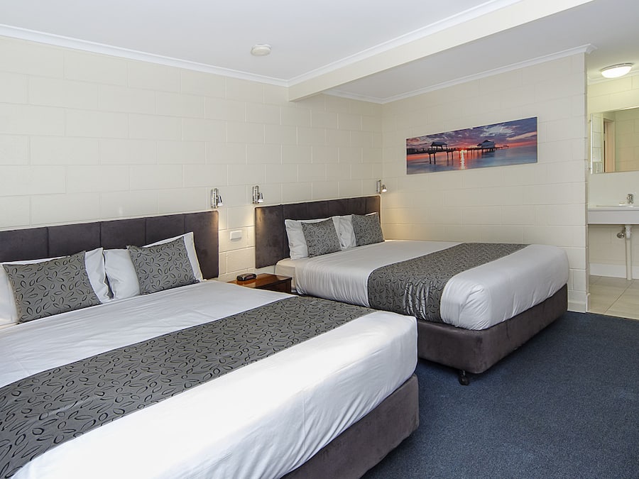 Standard Double Queen Room | Desk, blackout drapes, iron/ironing board, free WiFi