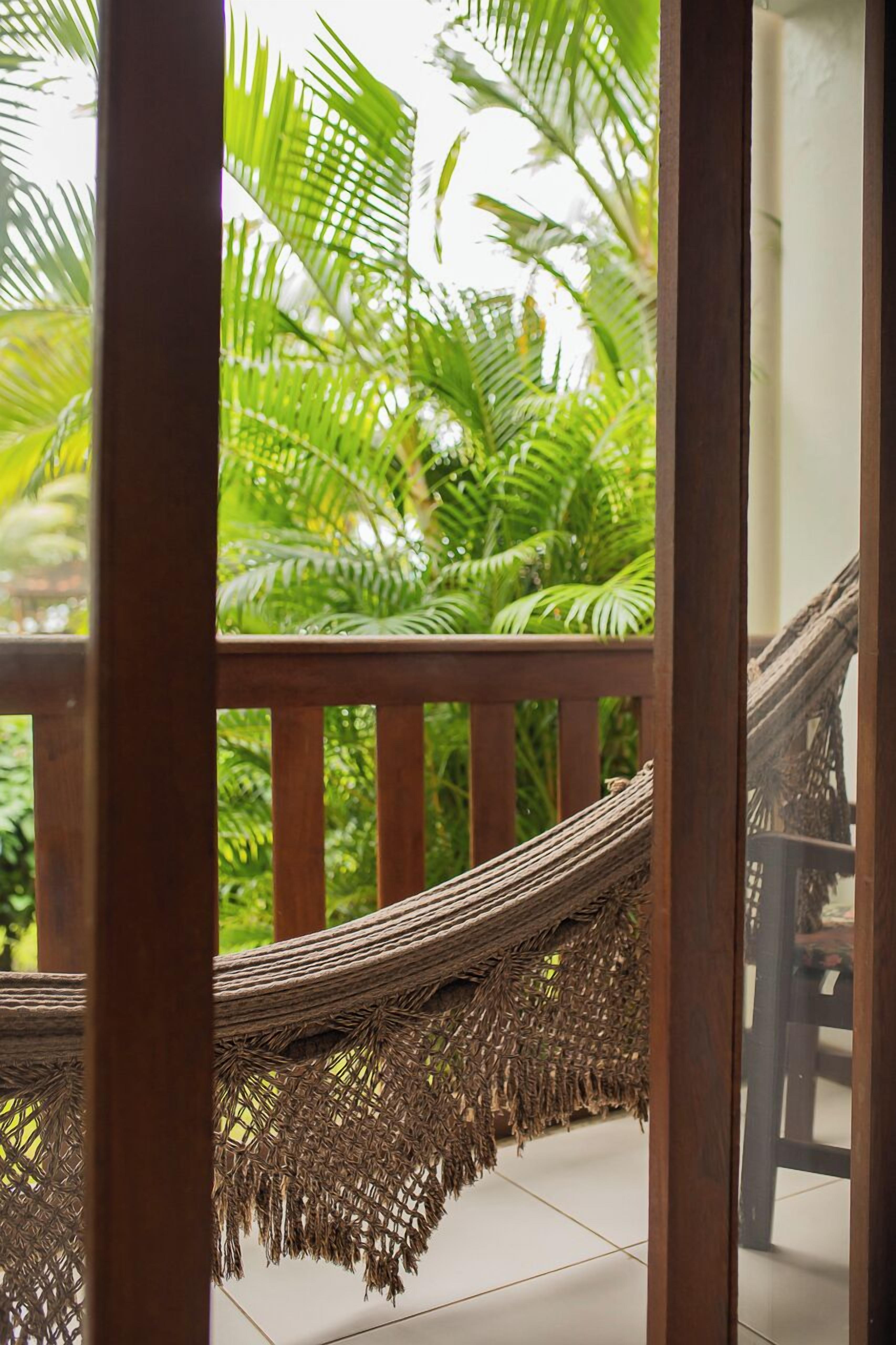 Suíte, sacada, no jardim | Roupas de cama premium, frigobar, cofres nos quartos, Wi-Fi de cortesia