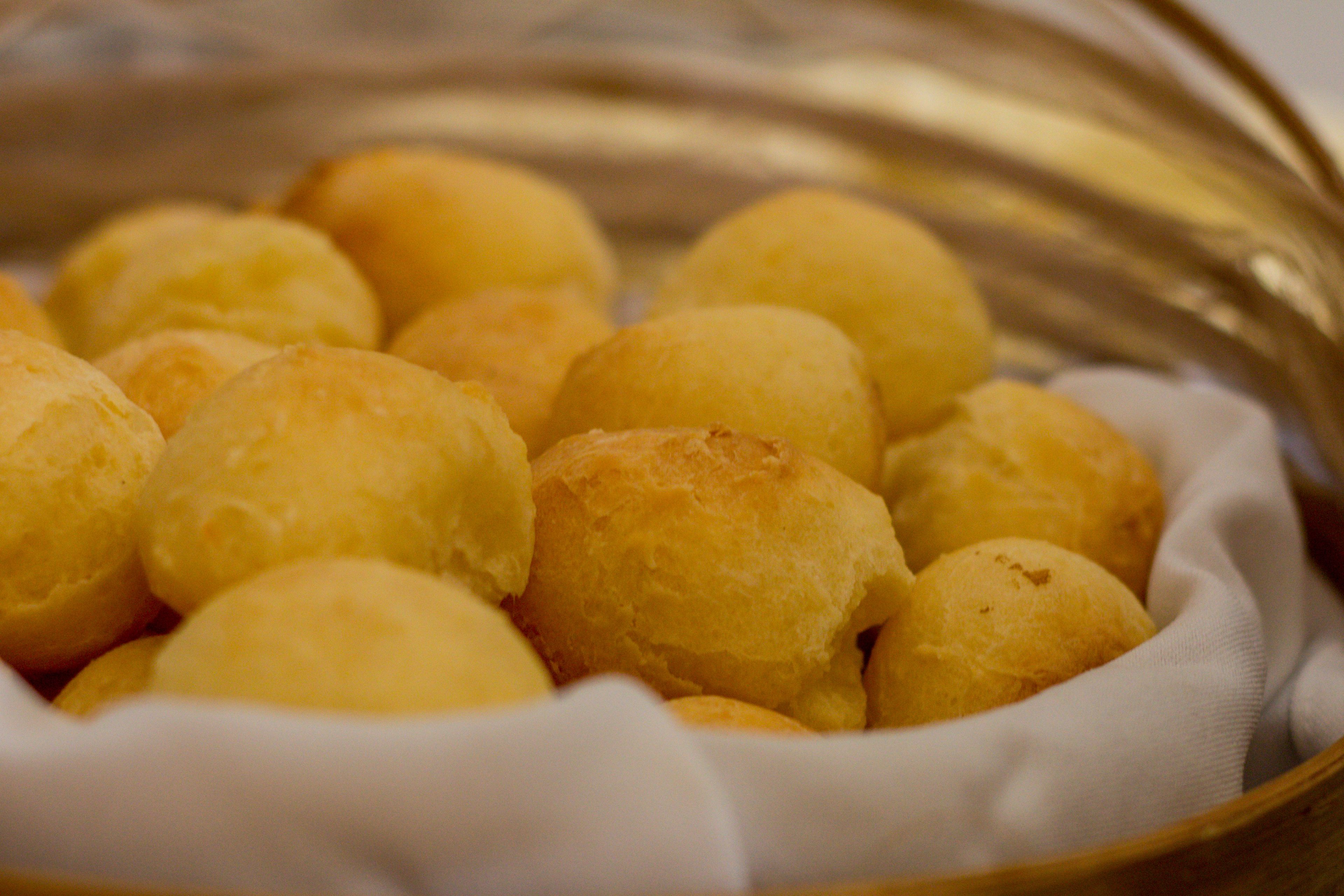 A bowl of round, golden-brown pastries.