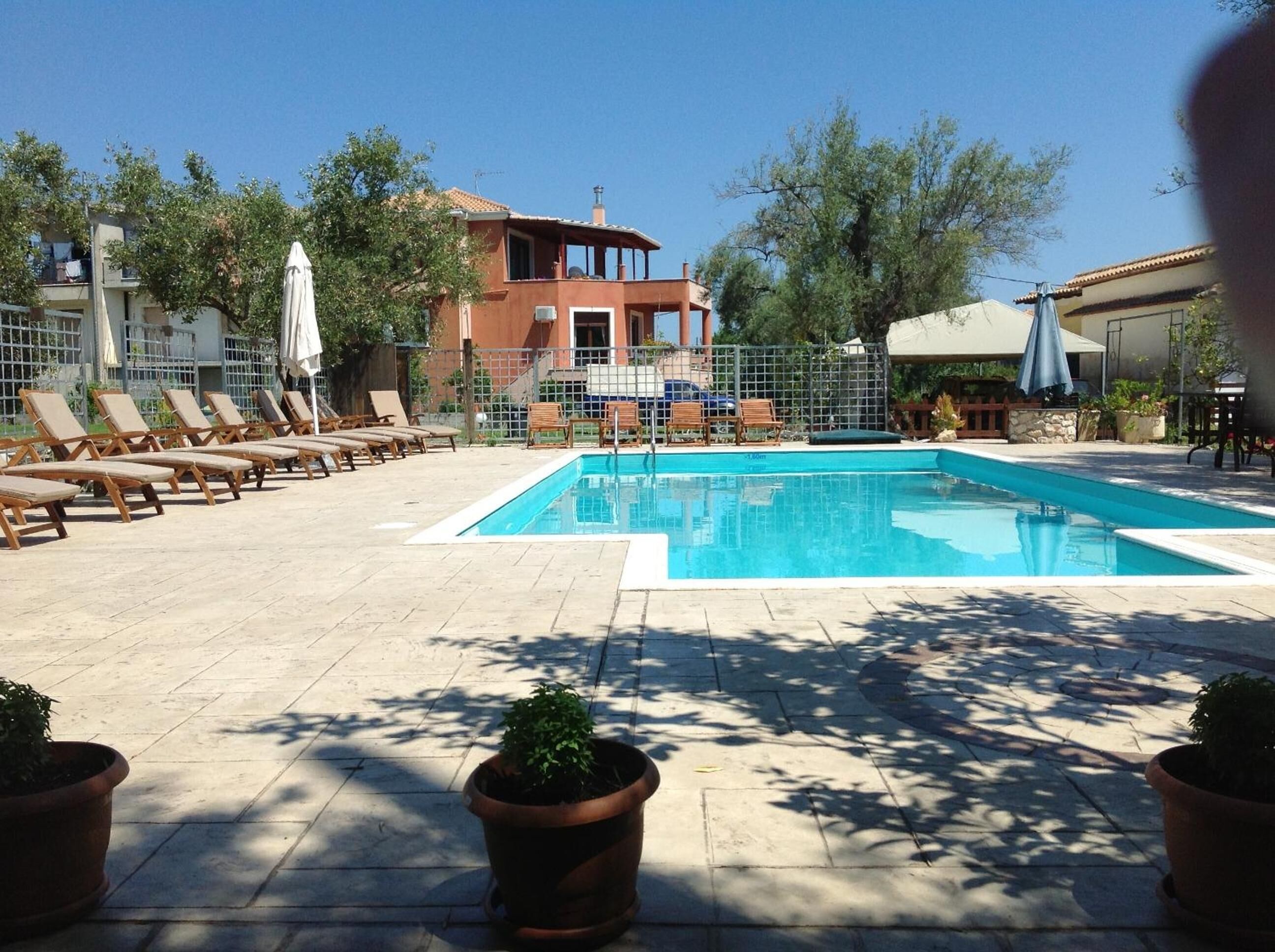 Seasonal outdoor pool, open 10 AM to 8 PM, pool umbrellas
