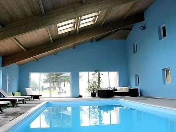 Indoor pool, open 8:00 AM to 9:00 PM, pool loungers