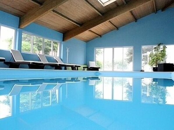 Indoor pool, open 8:00 AM to 9:00 PM, pool loungers