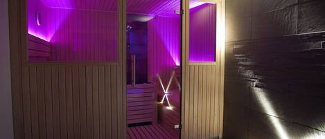 A room with wooden paneling, a purple-lit corner, and a brick wall.