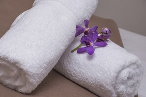 Desk, iron/ironing board, bed sheets