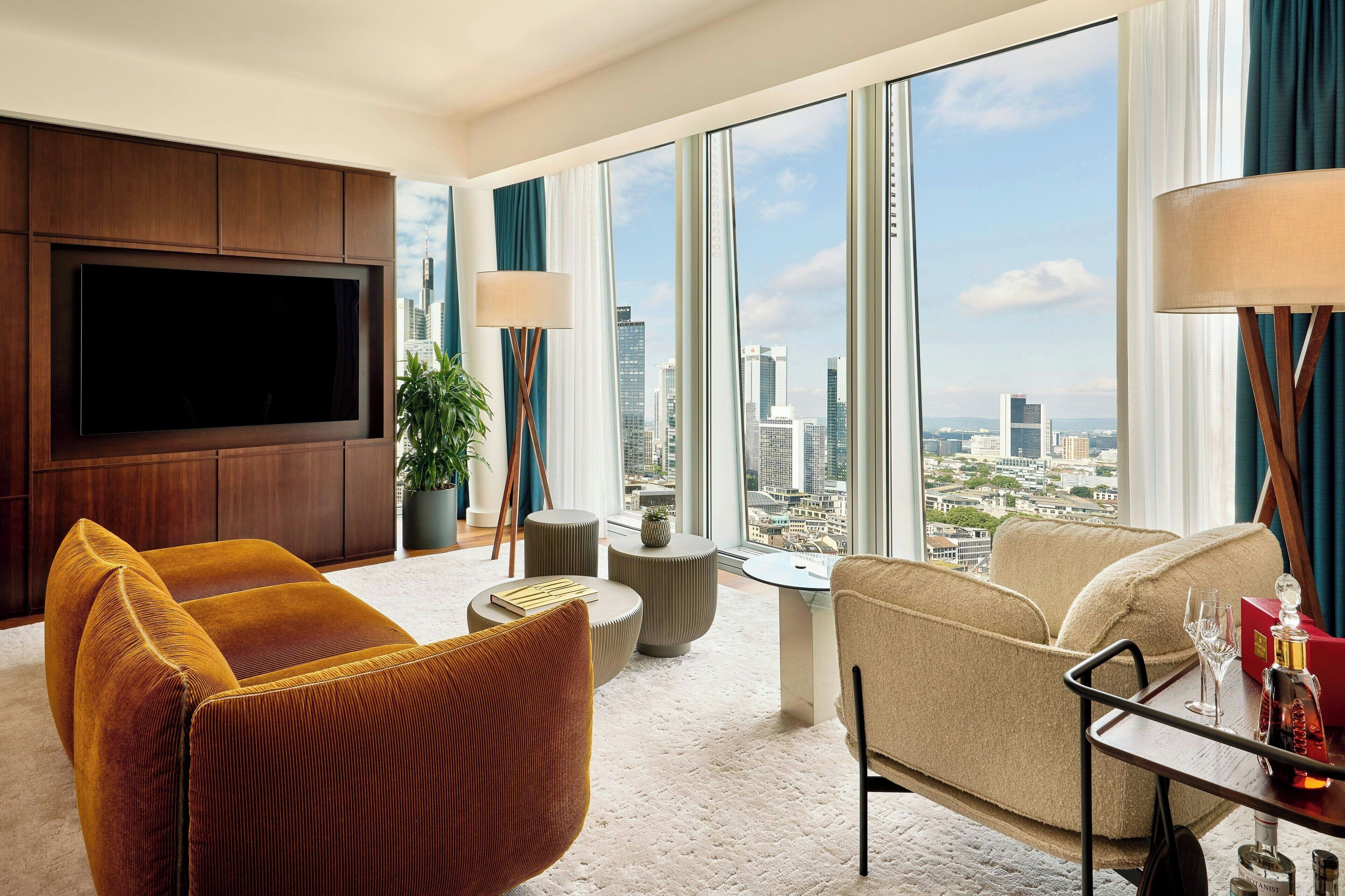 presidential suite, 1 king bed, non smoking | living room | 55-inch led tv with digital channels, tv, ipod dock