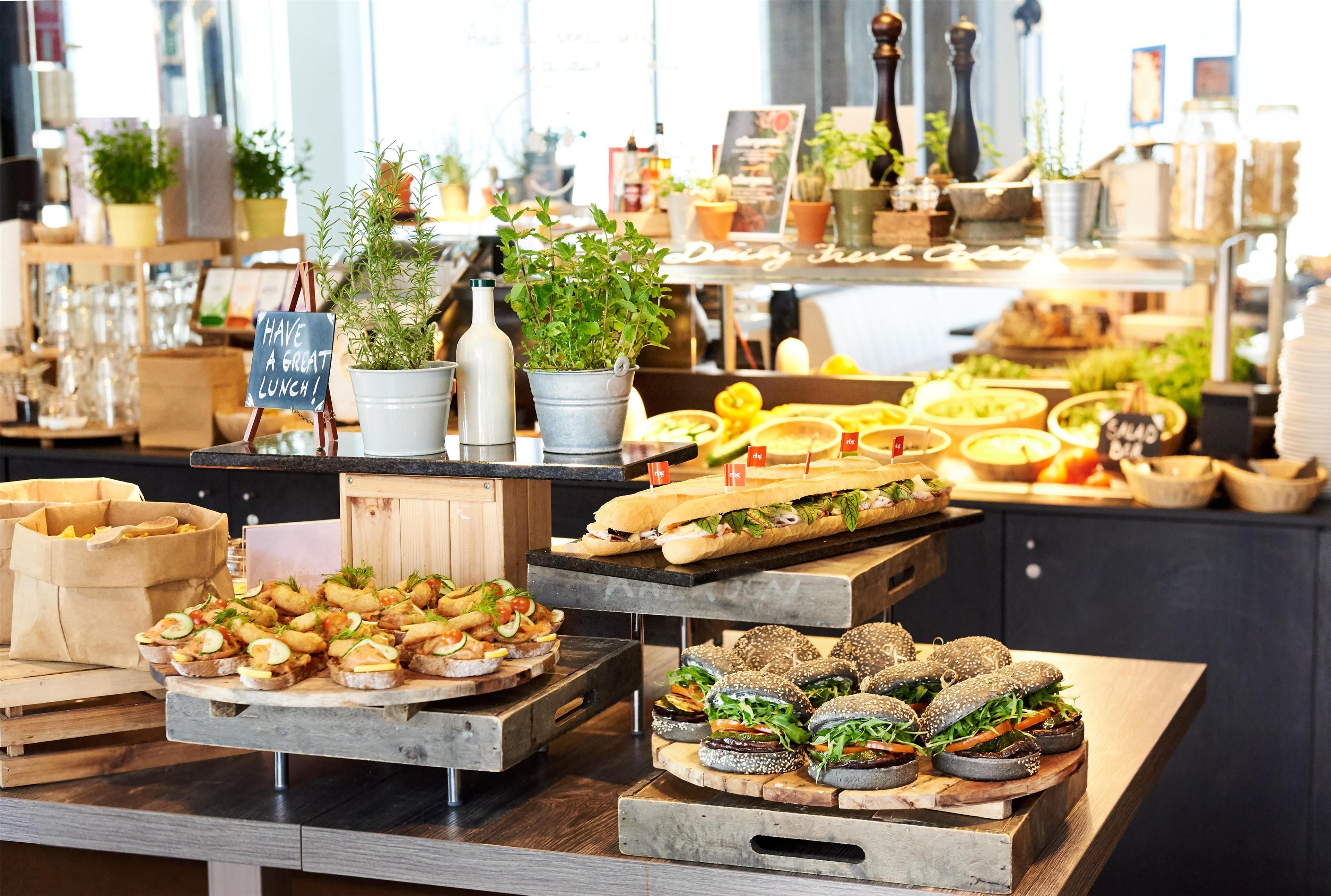 A buffet with various food items and a sign that says 'Have a great lunch!'