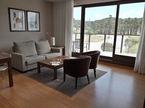 Side Beach Apartment – Ground Floor | Living room | 25-inch flat-screen TV with cable channels, LCD TV