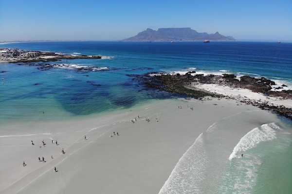 Beach nearby, white sand, beach towels