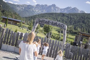 Children's play area - outdoor - Aparthotel Familiaris - Family Apartments - Pools & Spa in the Dolomites (Valdaora)