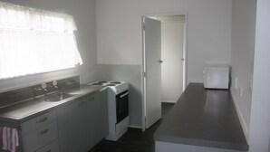 Apartment, 1 Bedroom | Private kitchenette | Coffee/tea maker, fridge, microwave, electric kettle - Burgundy Rose Motel (Whangarei)