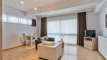 Apartment, 1 Bedroom | Living area | LCD TV