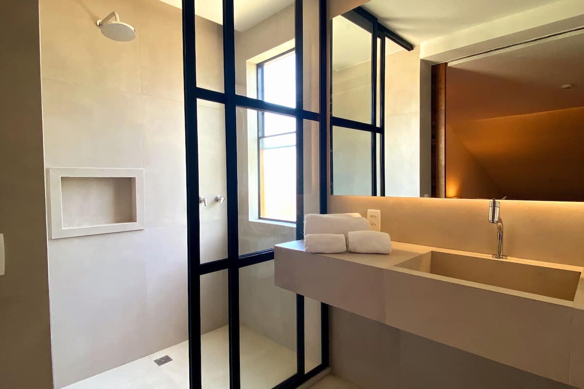 designer toiletries, hair dryer, bathrobes, slippers