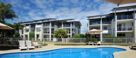 2 outdoor pools, open 6:00 AM to 9:00 PM, pool umbrellas, pool loungers