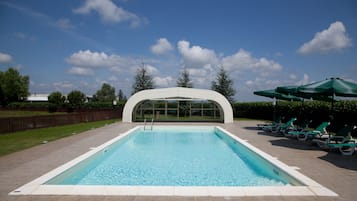 Seasonal outdoor pool, open 9:00 AM to 7:00 PM, pool umbrellas