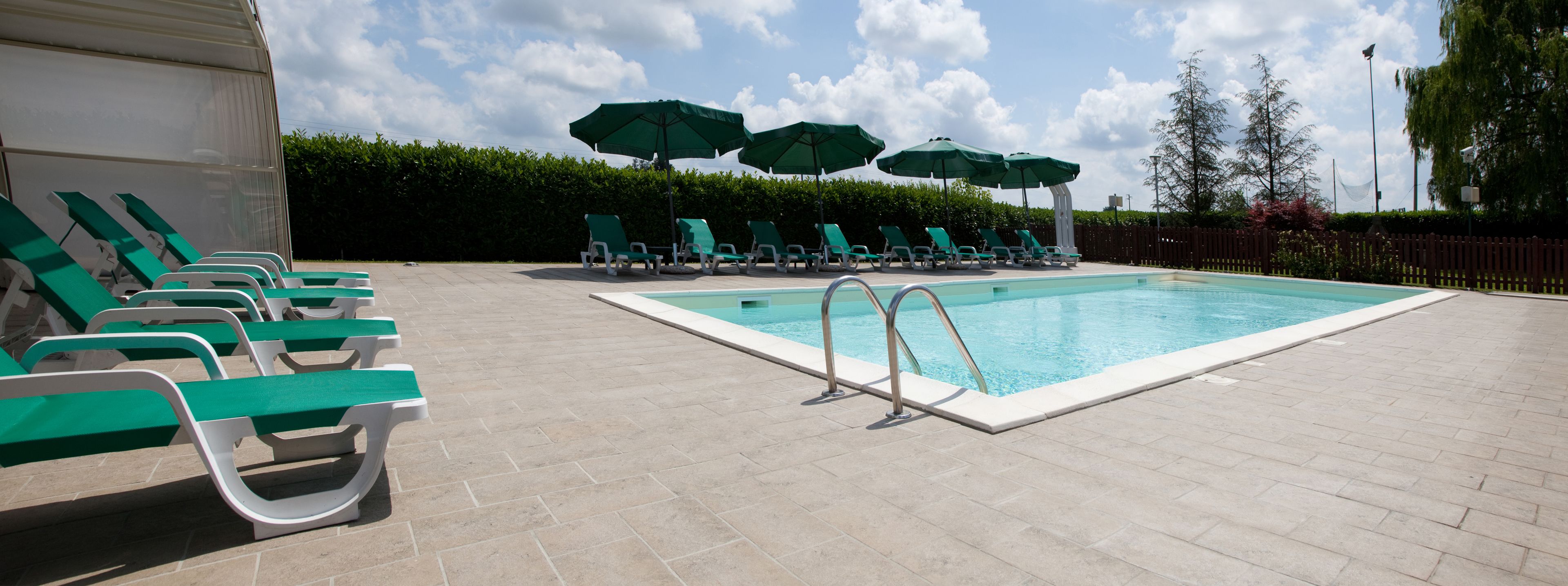 seasonal outdoor pool, open 10:00 am to 8:00 pm, pool umbrellas