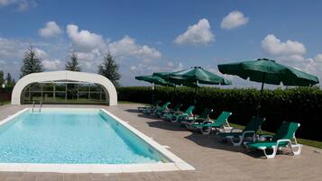 Seasonal outdoor pool, open 10:00 AM to 8:00 PM, pool umbrellas