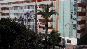 A hotel with multiple balconies, a prominent sign for 'Sol & Sombra hotel', and a clear view of the surrounding urban area. - Hotel Sol & Sombra (Benidorm)