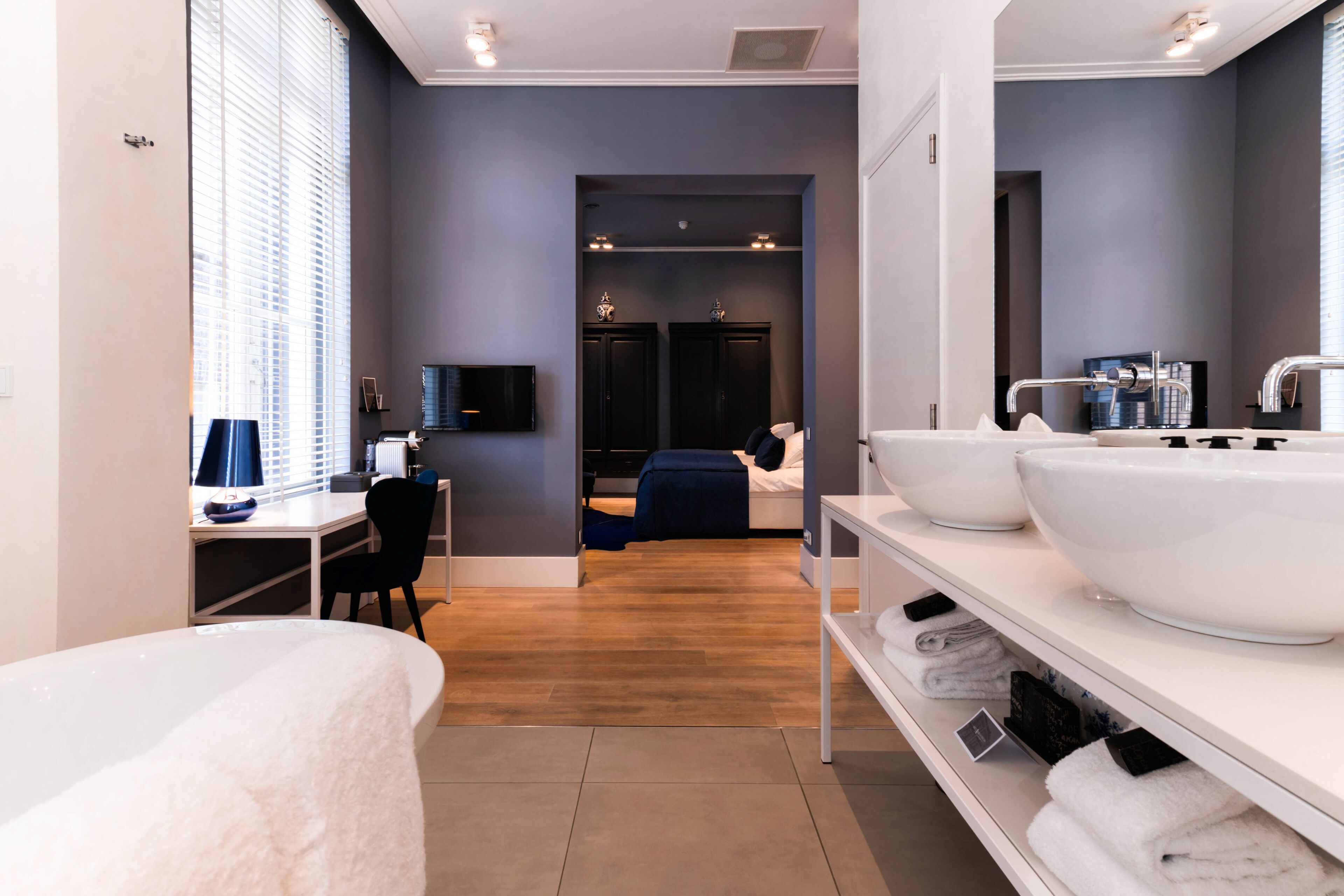 deluxe suite | premium bedding, minibar, in-room safe, desk