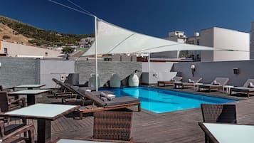 Outdoor pool, open 8:00 AM to 8:00 PM, free cabanas, pool umbrellas