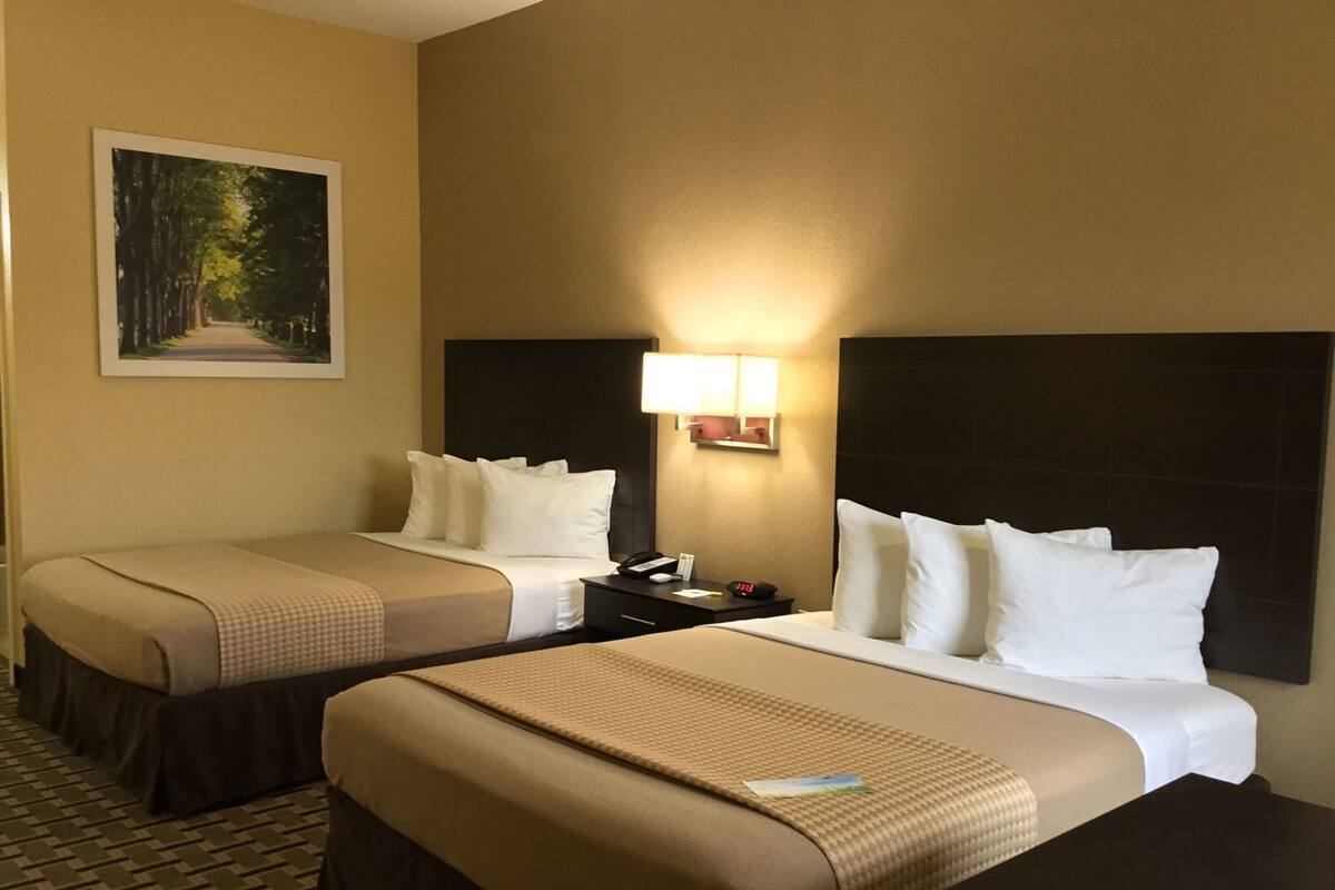 Pillowtop beds, desk, blackout drapes, iron/ironing board