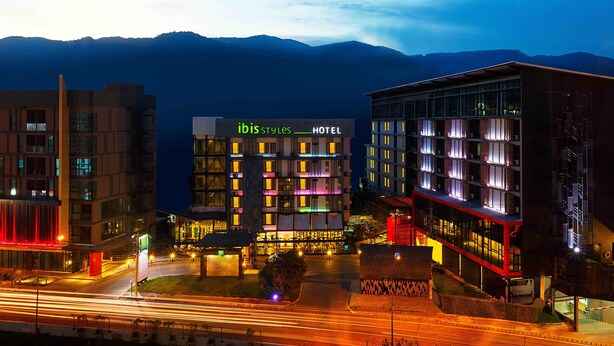 A hotel with a modern design, featuring a prominent sign that reads "ibis Styles HOTEL". - ibis Styles Chiang Mai (Chiang Mai)