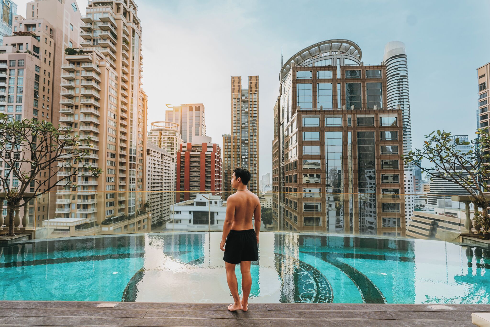 outdoor pool, open 6:00 am to 10:00 pm, pool umbrellas, pool loungers