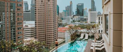 Outdoor pool, open 6:00 AM to 10:00 PM, pool umbrellas, pool loungers