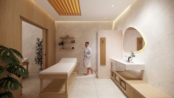 A modern spa room with a wooden reception desk, a massage table, a white sink, and a large mirror.