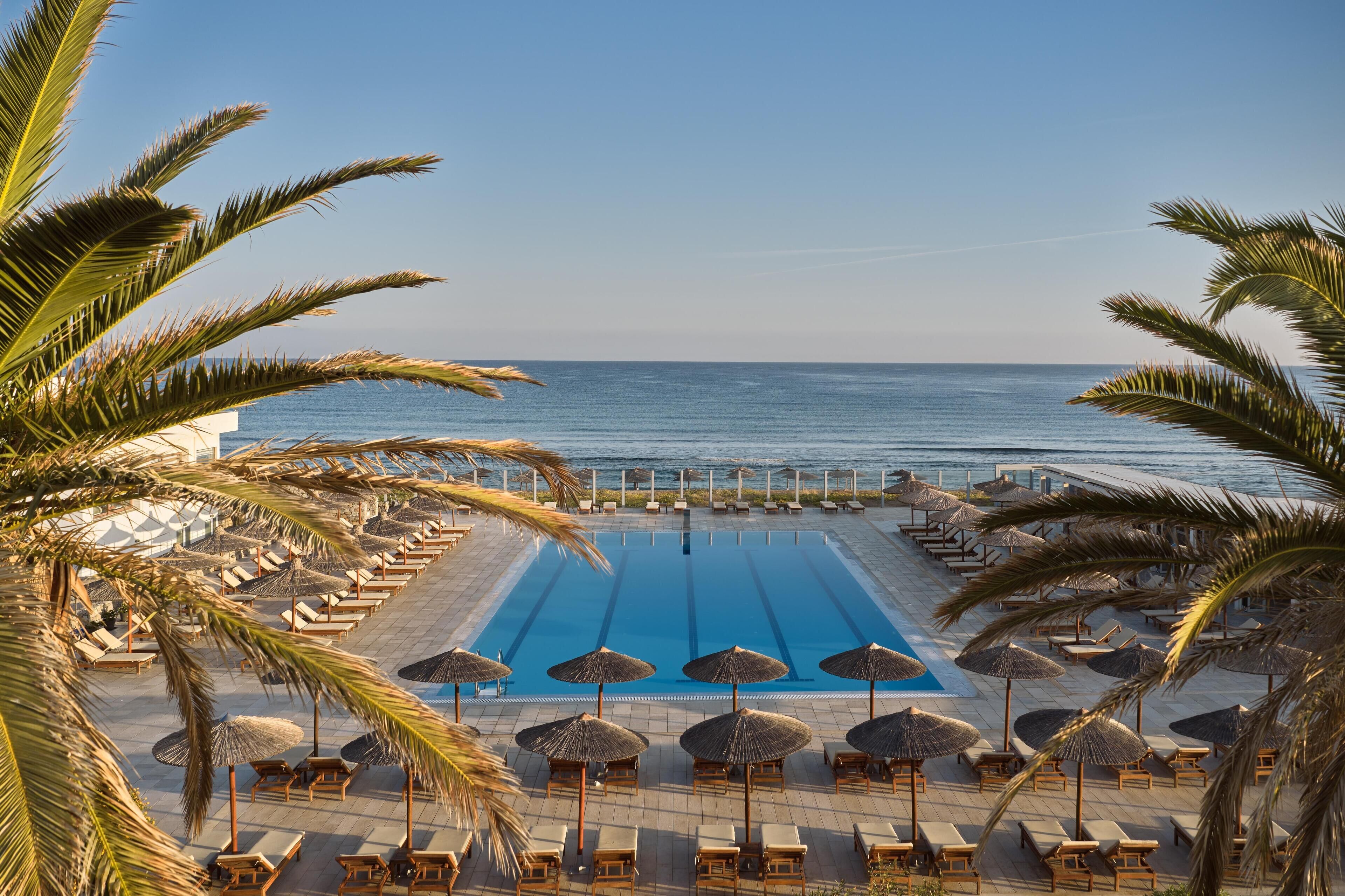 Seasonal outdoor pool, open 8:00 AM to 7:00 PM, pool umbrellas