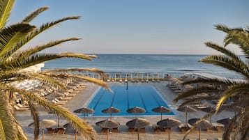 Seasonal outdoor pool, open 8:00 AM to 7:00 PM, pool umbrellas