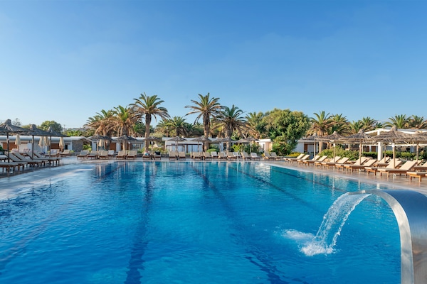 Seasonal outdoor pool, open 8:00 AM to 7:00 PM, pool umbrellas