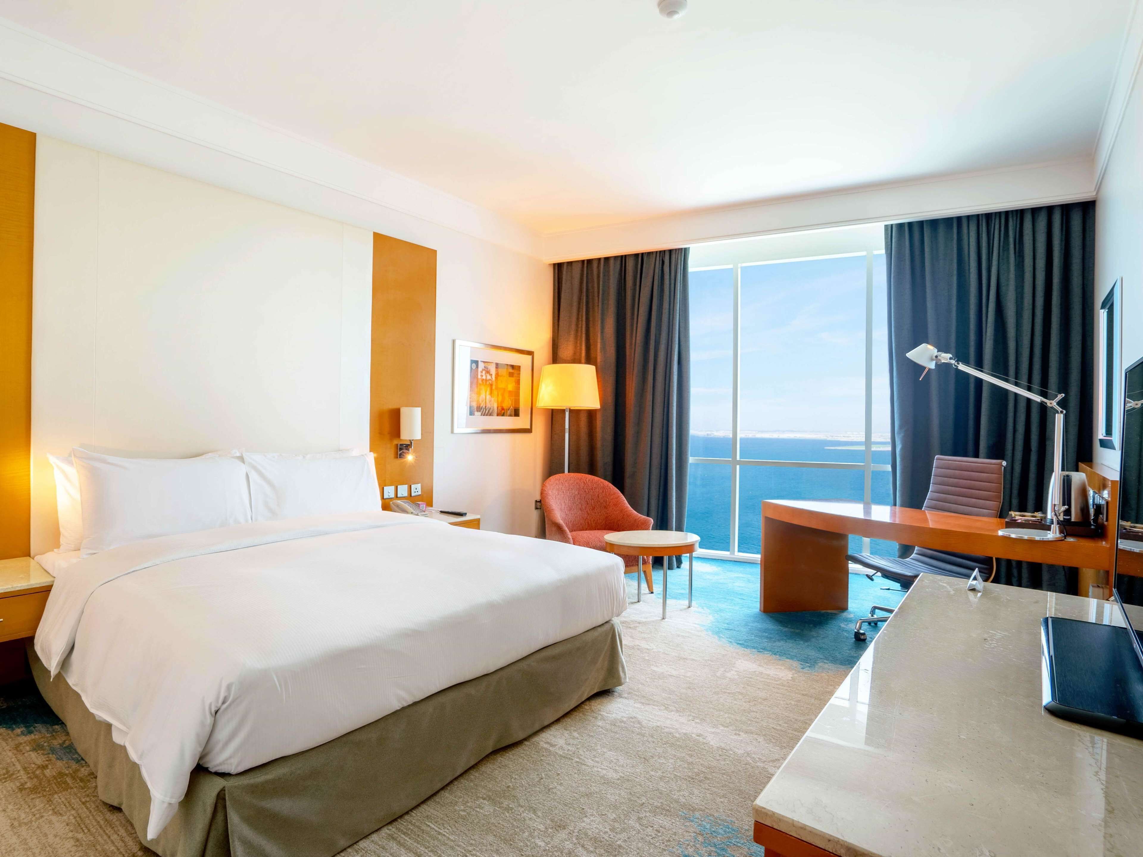 Deluxe Room, 1 King Bed, Sea View | Frette Italian sheets, premium bedding, down comforters, minibar