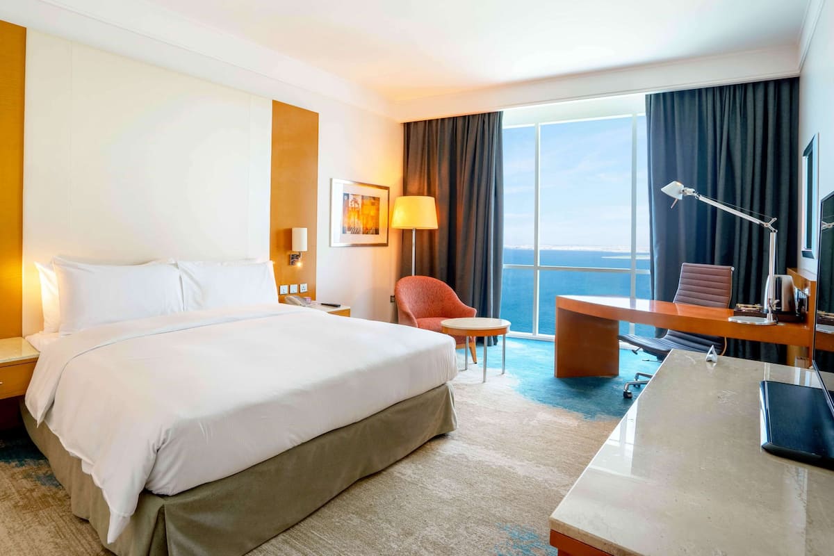 Deluxe Room, 1 King Bed, Sea View | Frette Italian sheets, premium bedding, down comforters, minibar